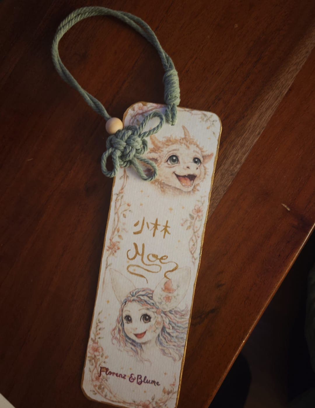 Handmade Florenz & Blume bookmark with a knotted green cord tassel